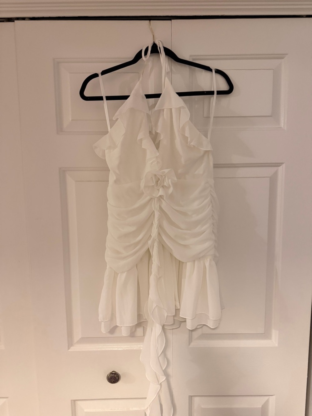 White Ruffled Mini Dress with Floral Accent